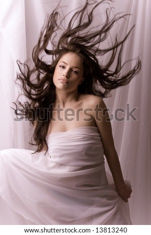 phantasy woman in white with flying hair