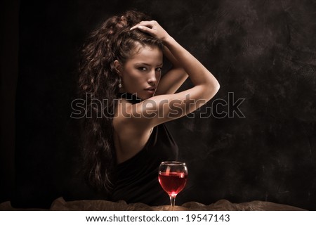 beautiful woman and glass of wine