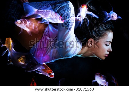 fantasy woman swimming with fishes