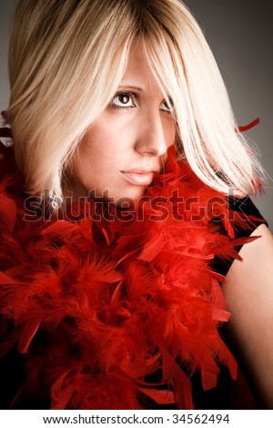 blond woman portrait with red plumage