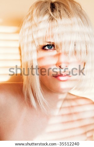 attractive blond woman portrait, indoor shot