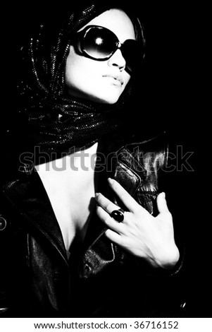 woman wrapped in scarf with sunglasses portrait, black and white