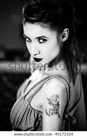 urban girl with tattoo on shoulder, black and white