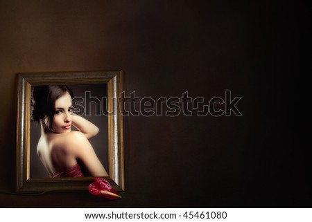 woman portrait in picture frame with red flower in front
