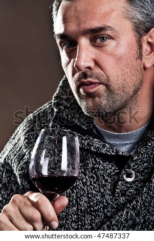man with wine in glass