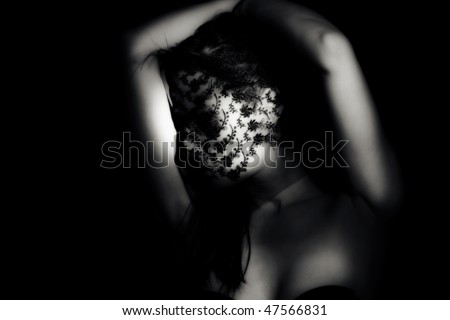 sensual adult woman with lace over face, black and white portrait