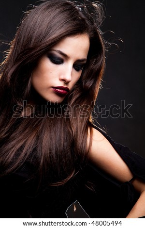 beautiful long hair brunette woman portrait, studio shot