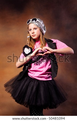 blond girl in a fancy clothes, studio shot