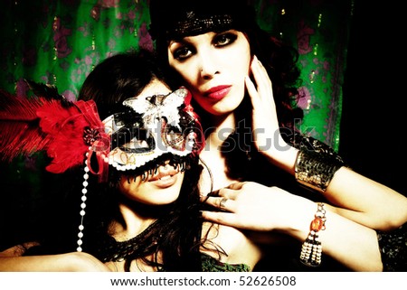 couple of women on a masquerade, indoor shot