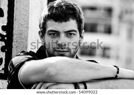 young man outdoor portrait, black and white