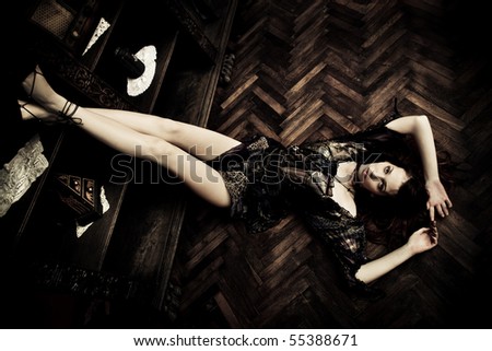 young fashion woman with in elegant dress on the floor  indoor shot