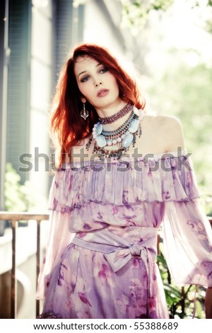red hair young woman in elegant dress, outdoor shot