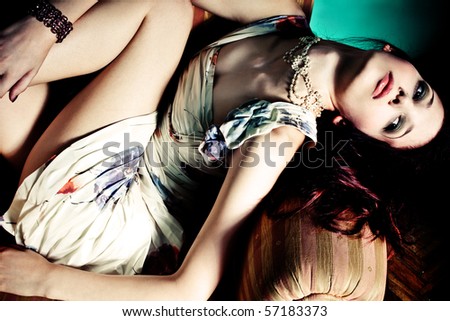 red hair woman lie in arm chair, indoor shot