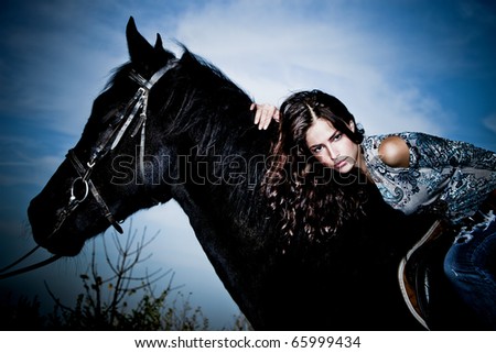 beautiful young brunette woman  ride black horse