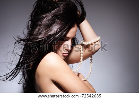 stock photo black hair beauty with pearl necklace studio shot