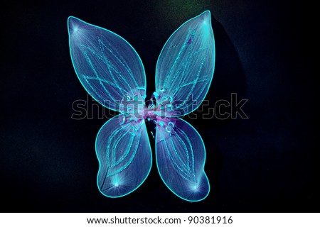 pair of fairy wings in blue color on dark background