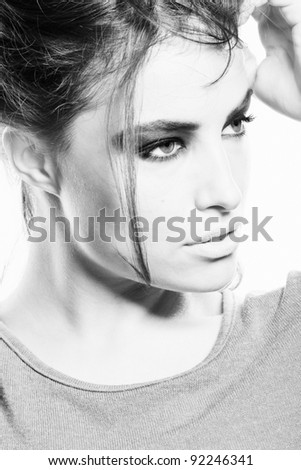 beautiful young woman with strong make up in black and white, small amount of grain added