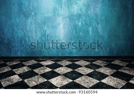 grunge blue wall and tiled floor in empty room