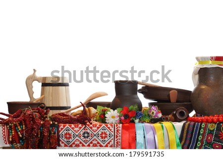 Ukrainian utensils put on the table in national style on an isolated white background