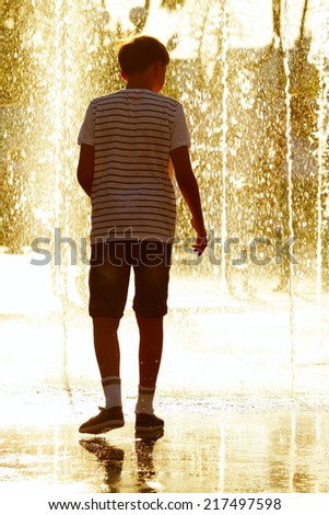 man in the rain in the summer in a good mood