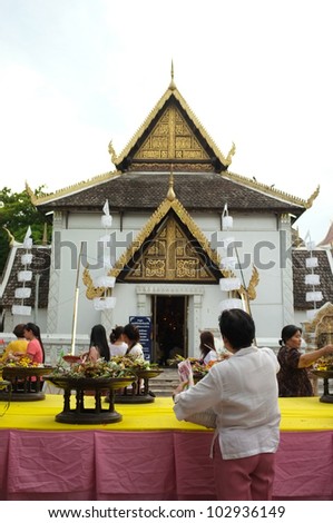 CHIANG MAI THAILAND-MAY 19 : Inthakhin traditional Offerings of flowers.Thai people offering flowers incense candles attended a ceremony to worship the city pillar.on May 19,2012 in Chiangmai Thailand