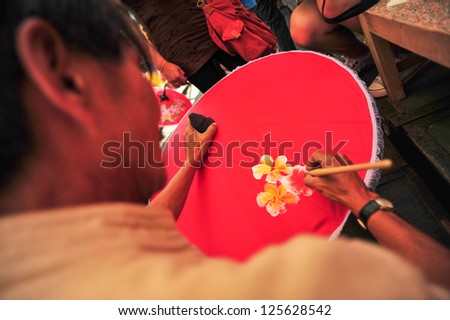 CHIANG MAI,THAILAND-JAN. 19 : 30th anniversary Bosang umbrella festival, People are interested in coming to visit the annual Umbrella festival at San Kamphaeng. on Jan.19, 2013 in Chiang Mai,Thailand.