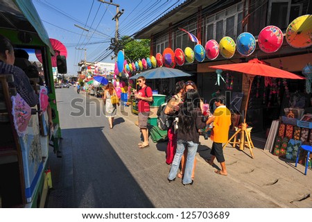 CHIANG MAI,THAILAND-JAN. 19 : 30th anniversary Bosang umbrella festival, People are interested in coming to visit the annual Umbrella festival at San Kamphaeng. on Jan.19, 2013 in Chiang Mai,Thailand.