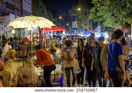 CHIANG MAI THAILAND - MARCH 8 : Sunday market walking street, Night marketing and trading of local tourists come to buy as souvenirs. on March 8 , 2015 in Chiang Mai, Thailand.