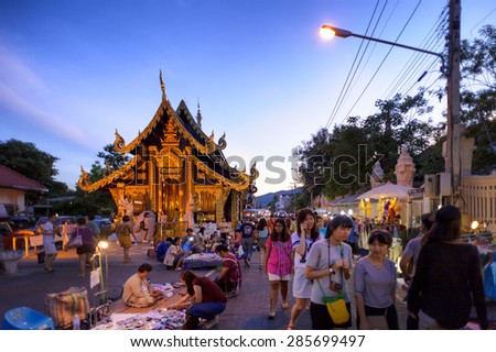 CHIANG MAI THAILAND - JUNE 7 : Sunday market walking street, The city center Thai temple marketing and trading of local tourists come to buy as souvenirs. on June 7, 2015 in Chiang Mai, Thailand.