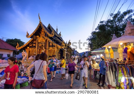 CHIANG MAI THAILAND - JUNE 7 : Sunday market walking street, The city center Thai temple marketing and trading of local tourists come to buy as souvenirs. on June 7, 2015 in Chiang Mai, Thailand.