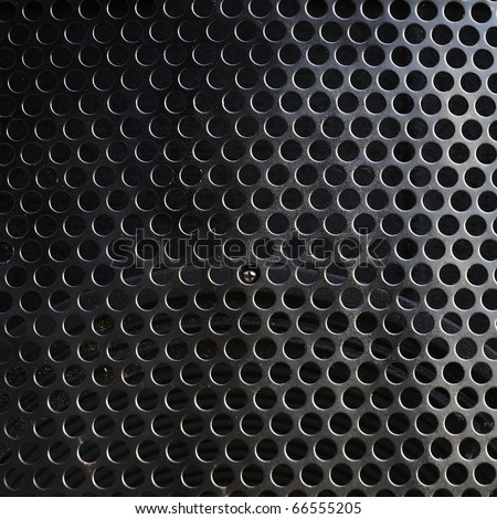 Metal holed or perforated grid background  Black hole