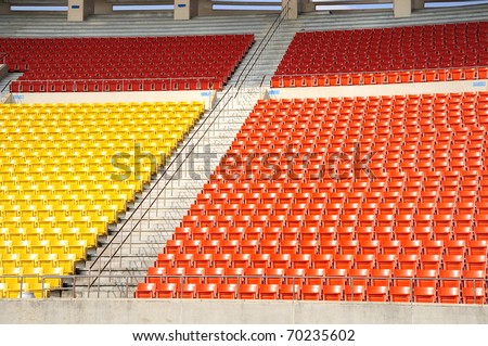 Seats at stadium entrance walk way