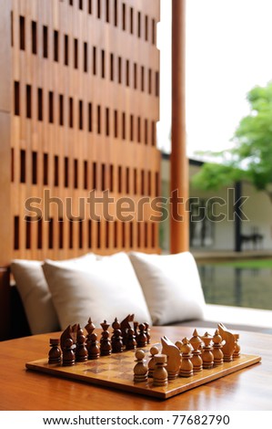 Playing chess in the park relaxing home.