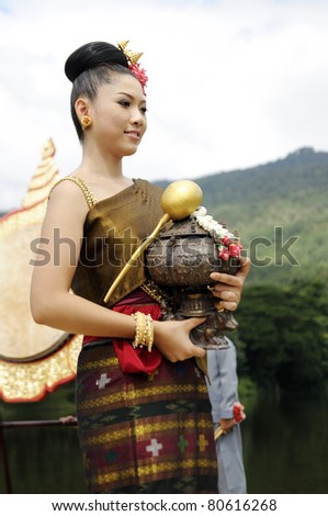 CHIANGMAI,THAILAND-JULY 7:The wai khru ceremony.Female Thai traditional costume parade. To pay homage to sacred ceremonies are held annually on July 7,2011 in Chiangmai, Thailand.