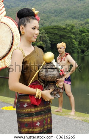 CHIANGMAI,THAILAND-JULY 7:The wai khru ceremony.Female Thai traditional costume parade. To pay homage to sacred ceremonies are held annually on July 7,2011 in Chiangmai, Thailand.
