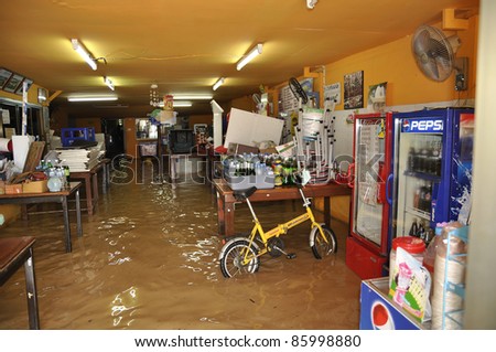 CHIANG MAI THAILAND - SEPTEMBER 28 : Flooding the Chiangmai city.Flood damage over a wide area stores on September 28,2011 in Chiangmai,Thailand