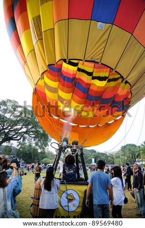 CHIANGMAI THAILAND-NOVEMBER 26 :Thailand International Balloon Festival in Chiangmai.People come to watch the release of balloons in the morning. on November 26,2011 in Chiangmai,Thailand