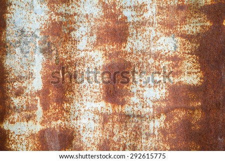 Close up of corroded iron plates and rivets on a wrecked ship. Background.