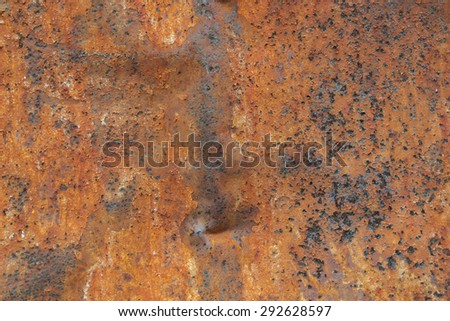 Close up of corroded iron plates and rivets on a wrecked ship. Background.