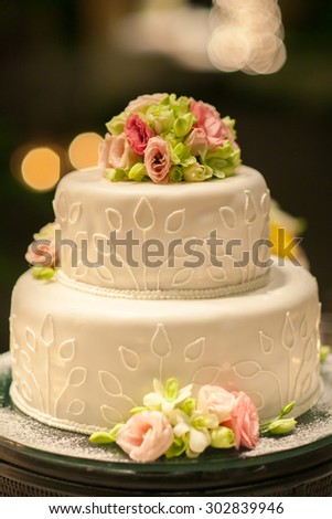 Wedding cake set up on table in wedding ceremony