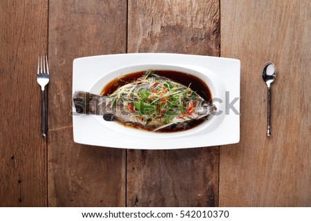 White Pomfret Steamed Dish with chinese sauce,Ready to eat. On The Table