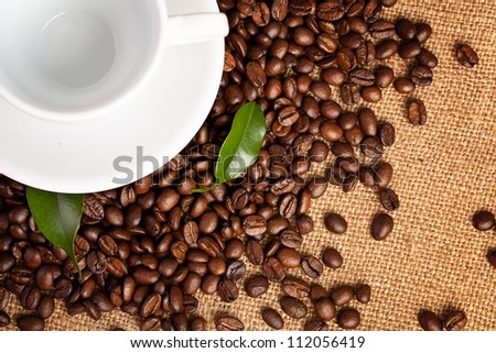 black roasted arabic coffee and empty cup