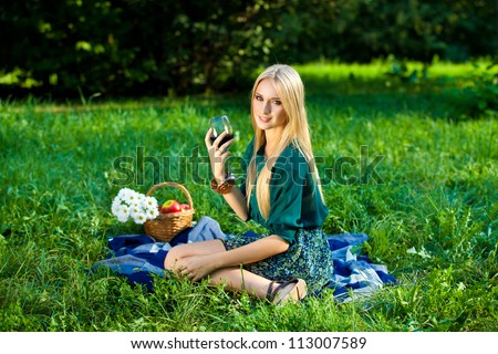 girl with a glass of wine outdoor picnic