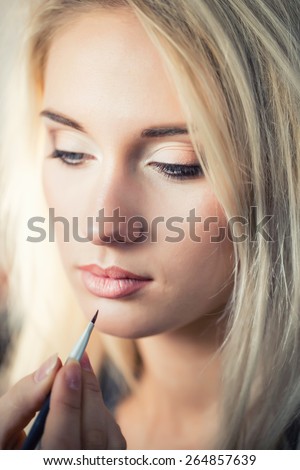 Woman with makeup brush. Stylist. make up brush