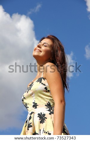 she smiles in the wind and sun