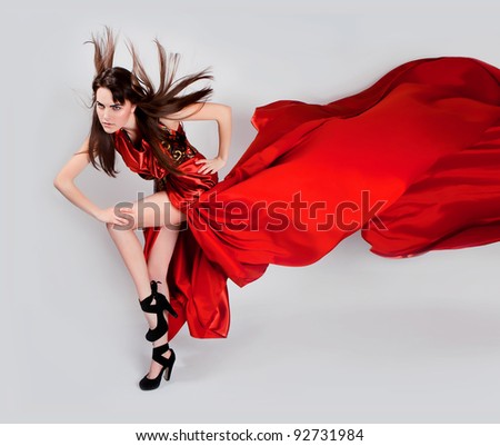 girl with flowing hair in the red dress