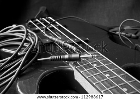  - stock-photo-still-life-with-electrical-guitar-and-jacks-black-and-white-112988617