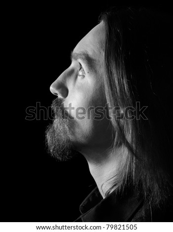 black and white profile of bearded man