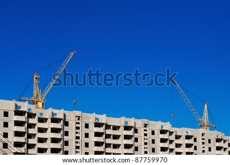 lifting cranes building apartment house
