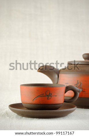 cup of tea and kettle, asian style still life, vertical
